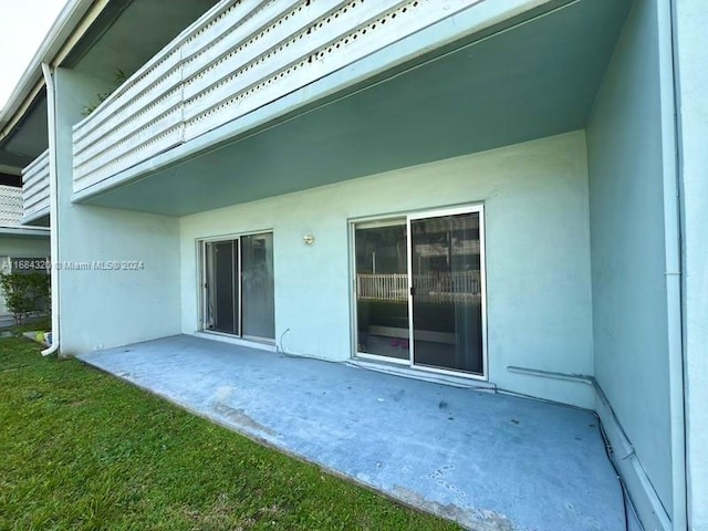 exterior space featuring a yard and a patio