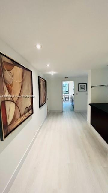 corridor featuring hardwood / wood-style flooring