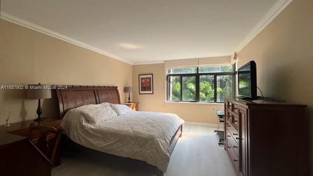 bedroom with crown molding