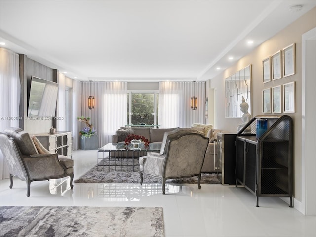 tiled living room featuring recessed lighting