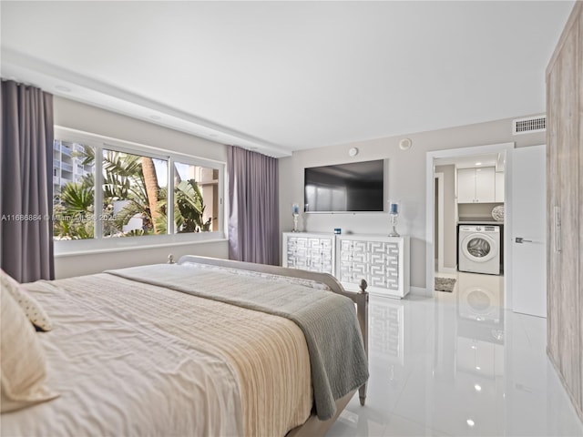 bedroom featuring washer / clothes dryer and visible vents