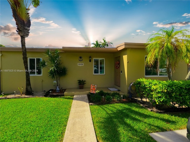 view of front of property with a front lawn