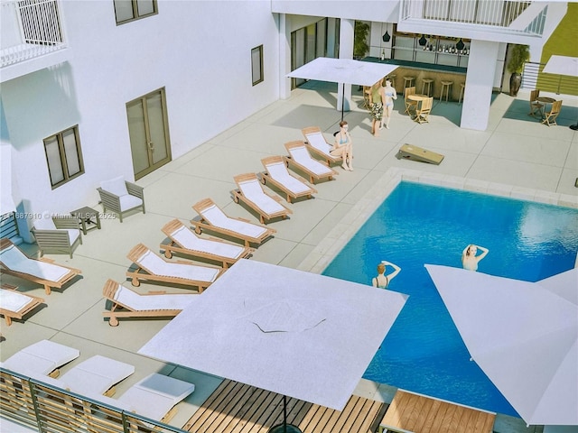 view of swimming pool featuring a patio