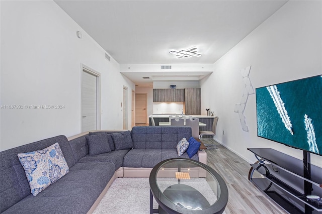 living room with light hardwood / wood-style flooring