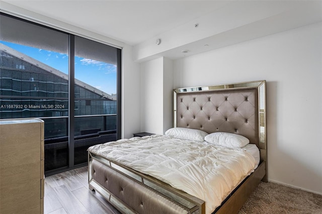 bedroom with light wood-type flooring