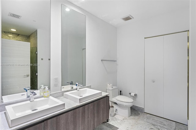 bathroom with vanity, toilet, and an enclosed shower