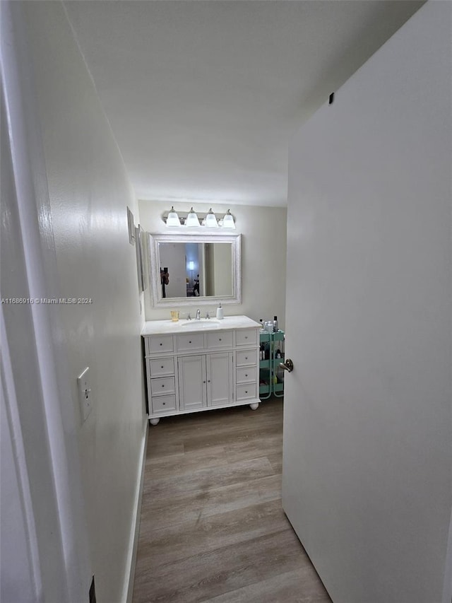 bathroom featuring vanity and hardwood / wood-style floors