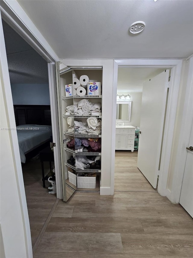 hallway featuring wood-type flooring