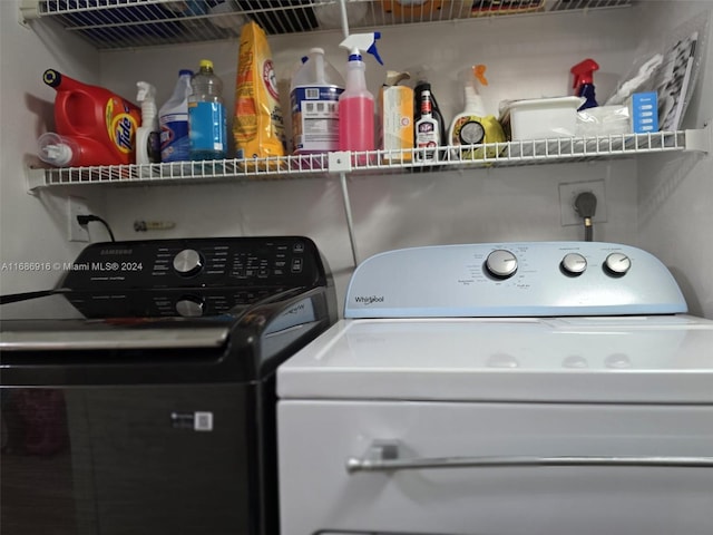 laundry room featuring washing machine and clothes dryer