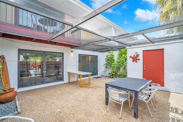 view of patio / terrace featuring a lanai