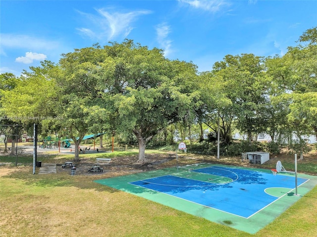 view of basketball court featuring a yard