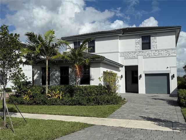 view of front of property with a garage