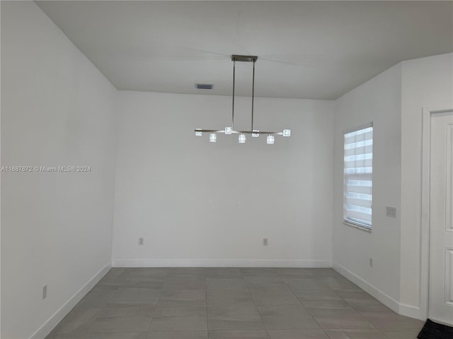 unfurnished dining area with light tile patterned flooring