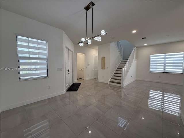 foyer with tile patterned floors