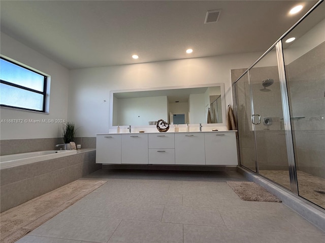 bathroom with vanity, shower with separate bathtub, and tile patterned flooring