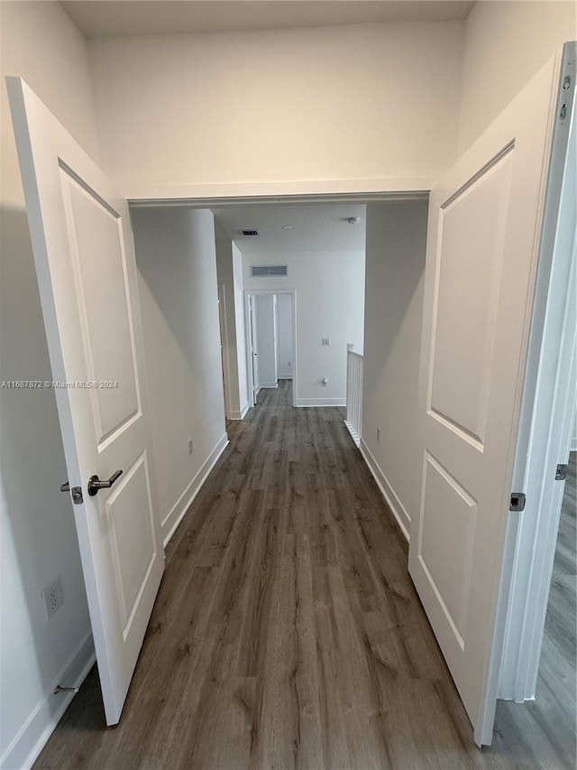 hall featuring dark wood-type flooring