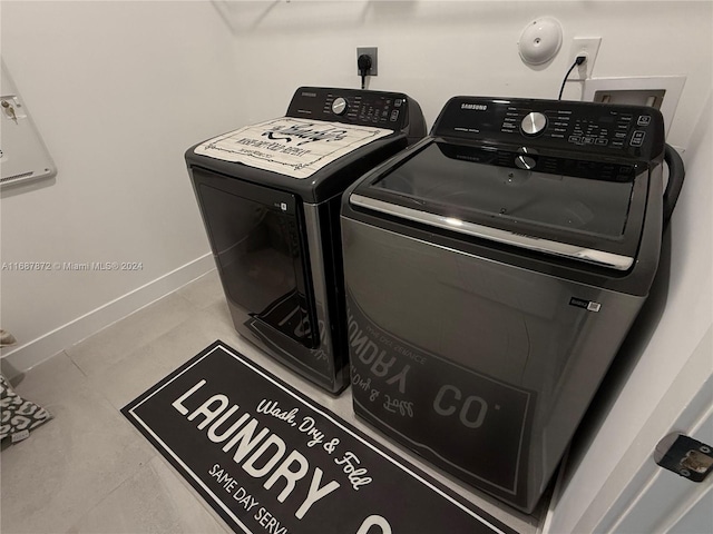 washroom with independent washer and dryer