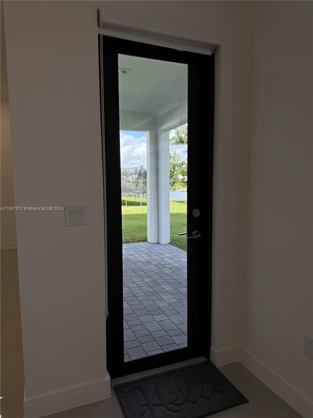 doorway featuring light tile patterned floors