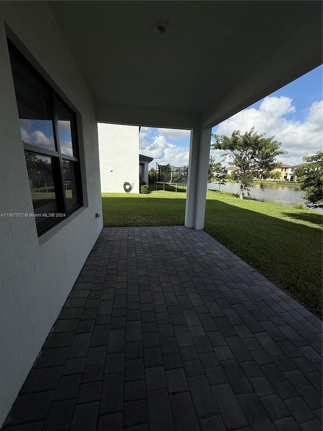 view of patio / terrace featuring a water view