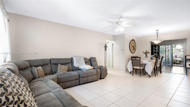 living room with light tile patterned flooring and ceiling fan