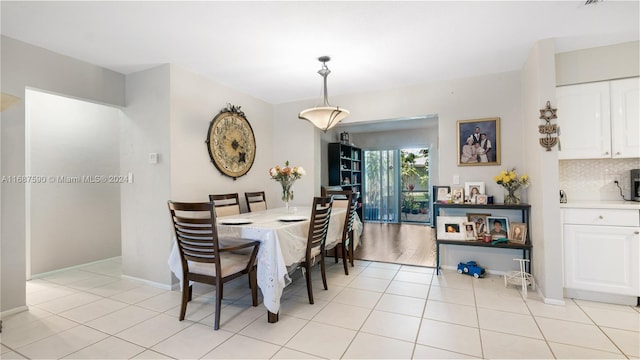 dining space with light tile patterned floors