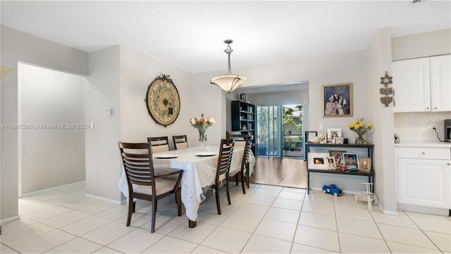 9404 NW 70th Pl, Tamarac, FL 33321 - dining space featuring light tile patterned floors and baseboards