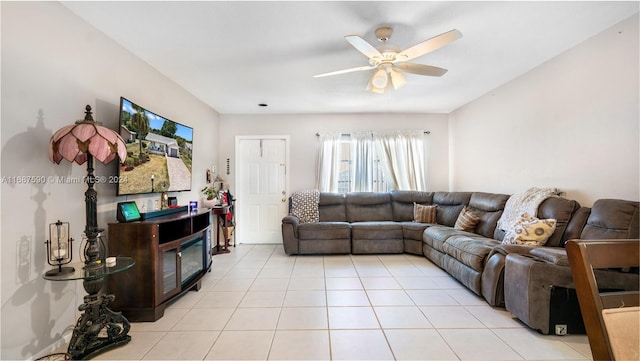 tiled living room featuring ceiling fan