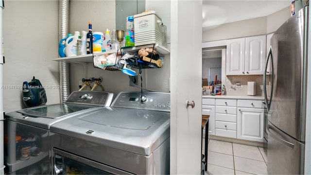 9404 NW 70th Pl, Tamarac, FL 33321 - laundry room featuring washing machine and clothes dryer and light tile patterned floors