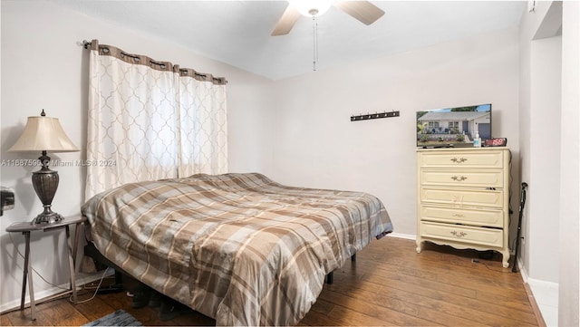 bedroom featuring dark hardwood / wood-style floors and ceiling fan