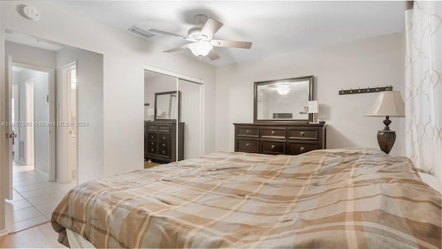 tiled bedroom with a closet and ceiling fan