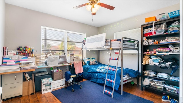 bedroom featuring ceiling fan and dark hardwood / wood-style flooring