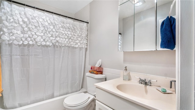 full bathroom with vanity, toilet, and shower / tub combo