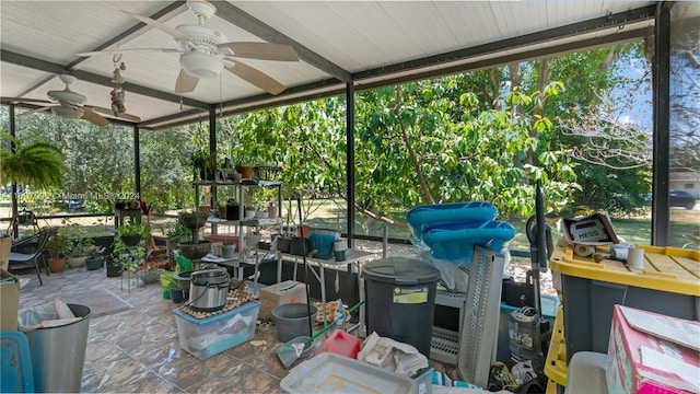 exterior space with beam ceiling and ceiling fan