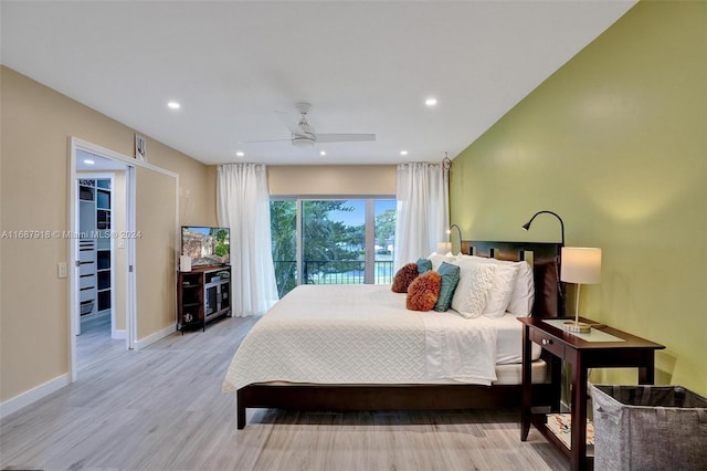 bedroom with ceiling fan, light hardwood / wood-style floors, and access to exterior