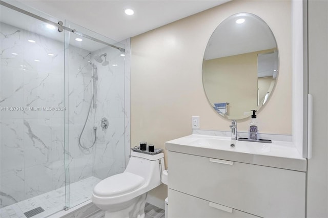 bathroom featuring vanity, toilet, and an enclosed shower