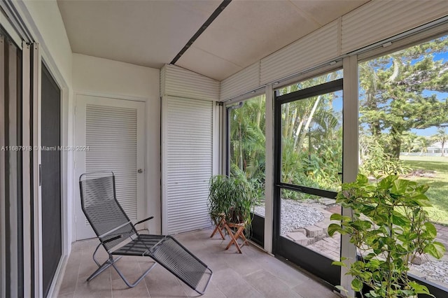 sunroom / solarium with lofted ceiling