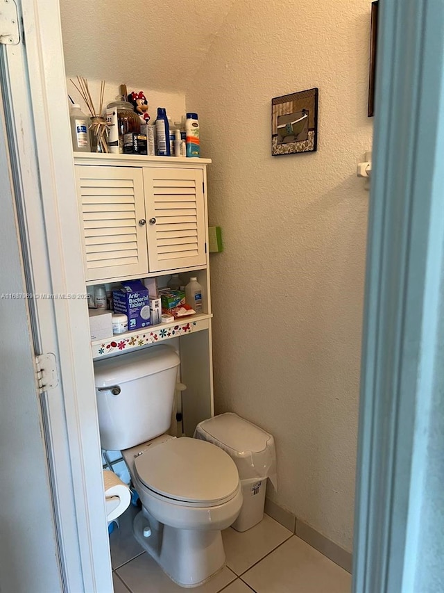 bathroom featuring tile patterned floors and toilet