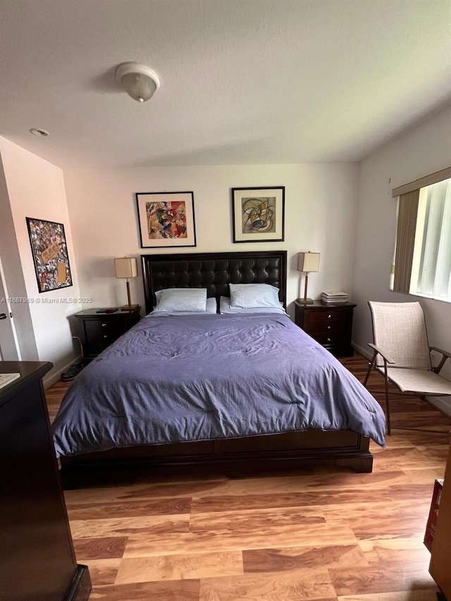 bedroom with light hardwood / wood-style flooring