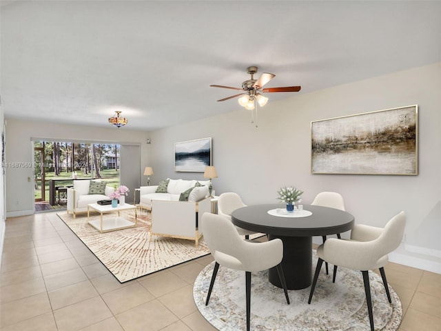 dining room with ceiling fan and light tile patterned floors