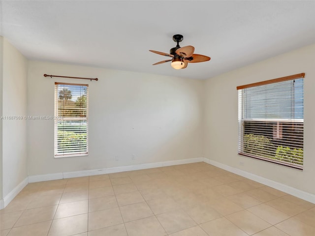 tiled empty room with ceiling fan