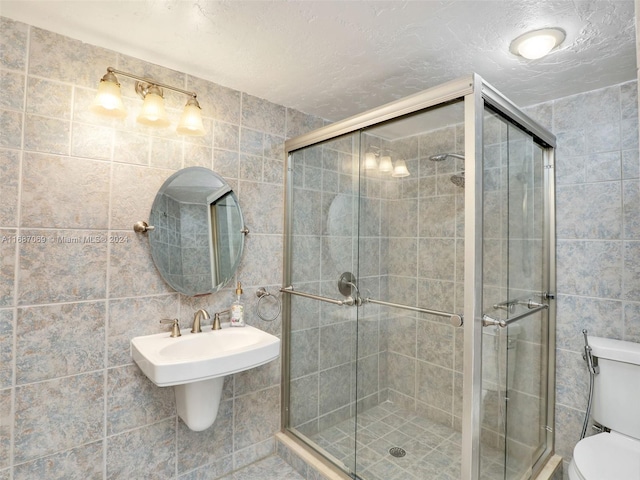 bathroom featuring toilet and tile walls