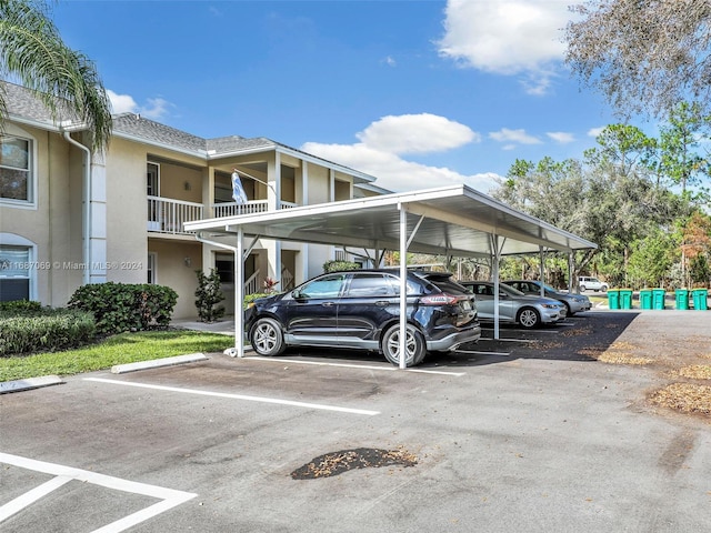 view of parking / parking lot featuring a carport