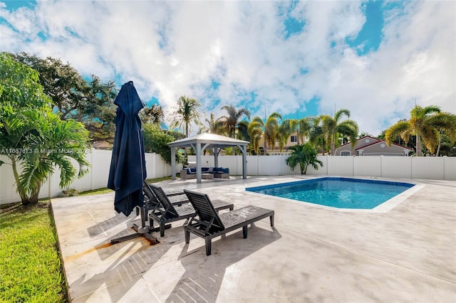 view of pool featuring a gazebo and a patio area