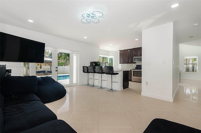 living room with light tile patterned flooring