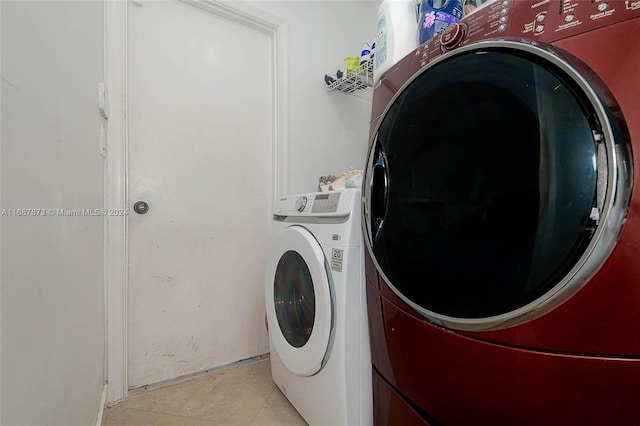 clothes washing area with washer / dryer