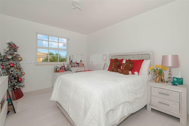 bedroom with light carpet