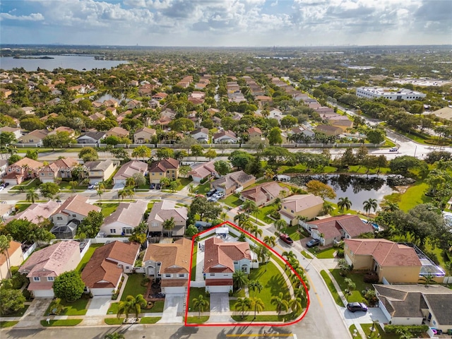 birds eye view of property featuring a water view