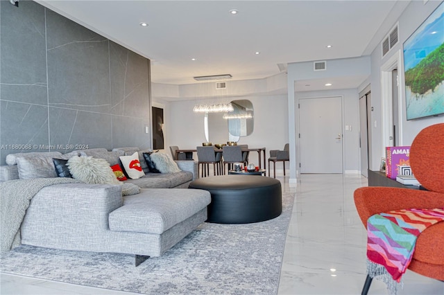 living room featuring an inviting chandelier