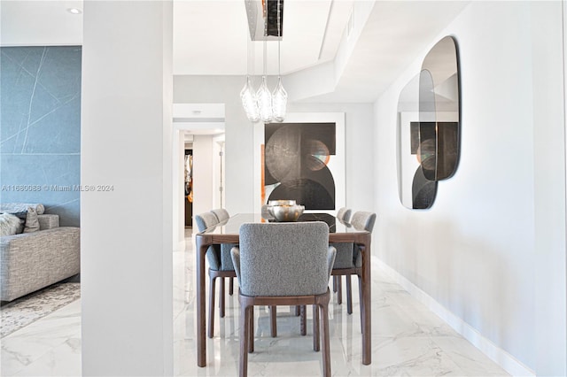 dining room featuring a notable chandelier