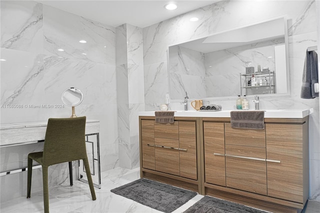 bathroom featuring tile walls and vanity